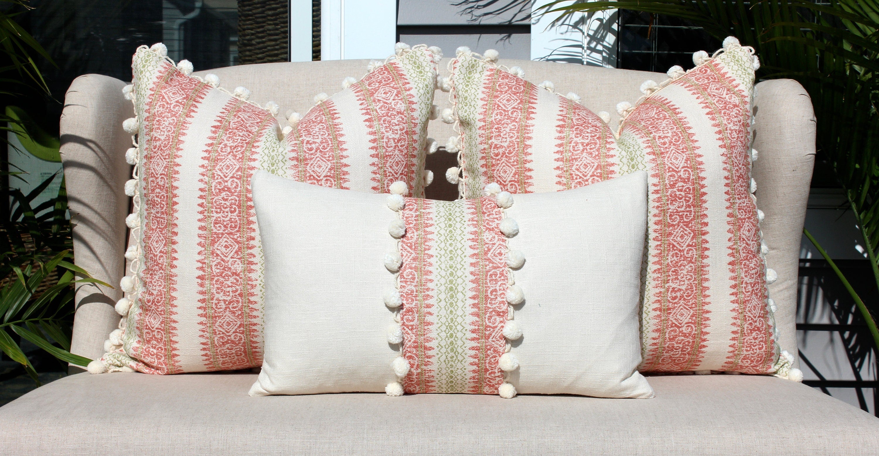 Boho Striped Pillow Cover in Coral and Lime Green embellished with Cream Ball Fringe.