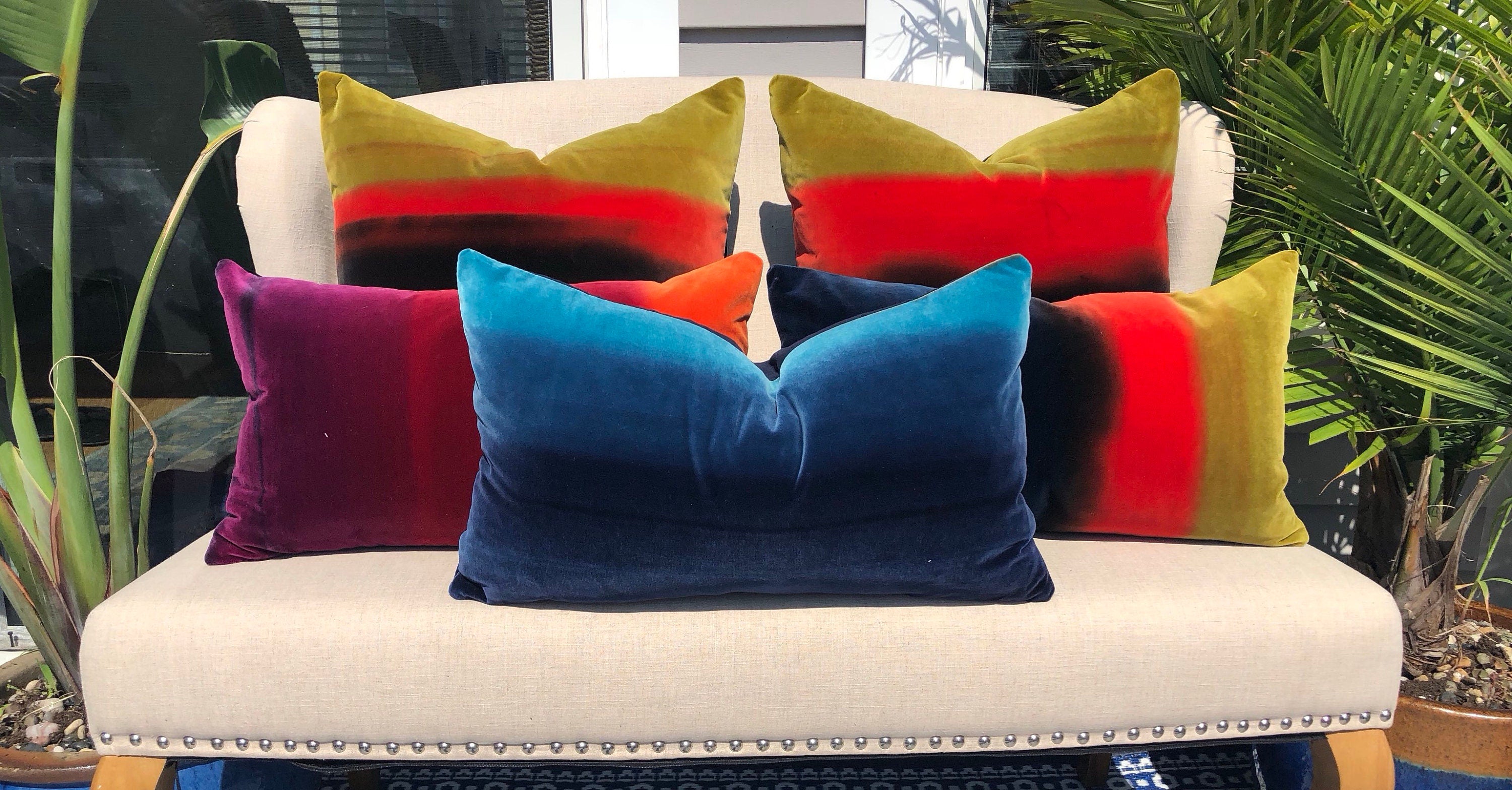 Harlequin Designer Velvet Pillow in Cocoa, Lagoon, Blueberry. Amazilia Lumbar Velvet Pillow Cover Tan, Aqua Blue, Indigo.