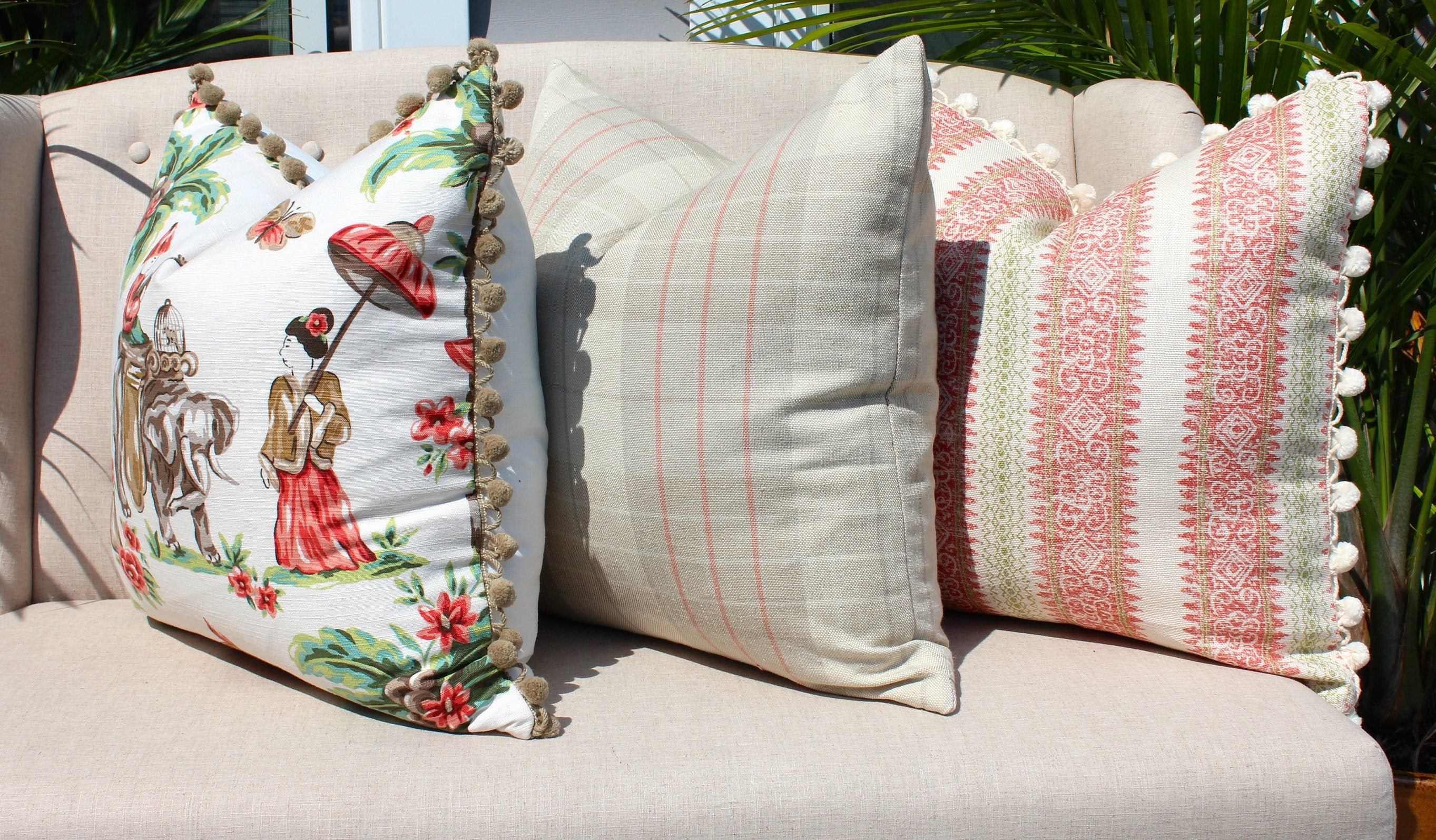 Boho Striped Pillow Cover in Coral and Lime Green embellished with Cream Ball Fringe.