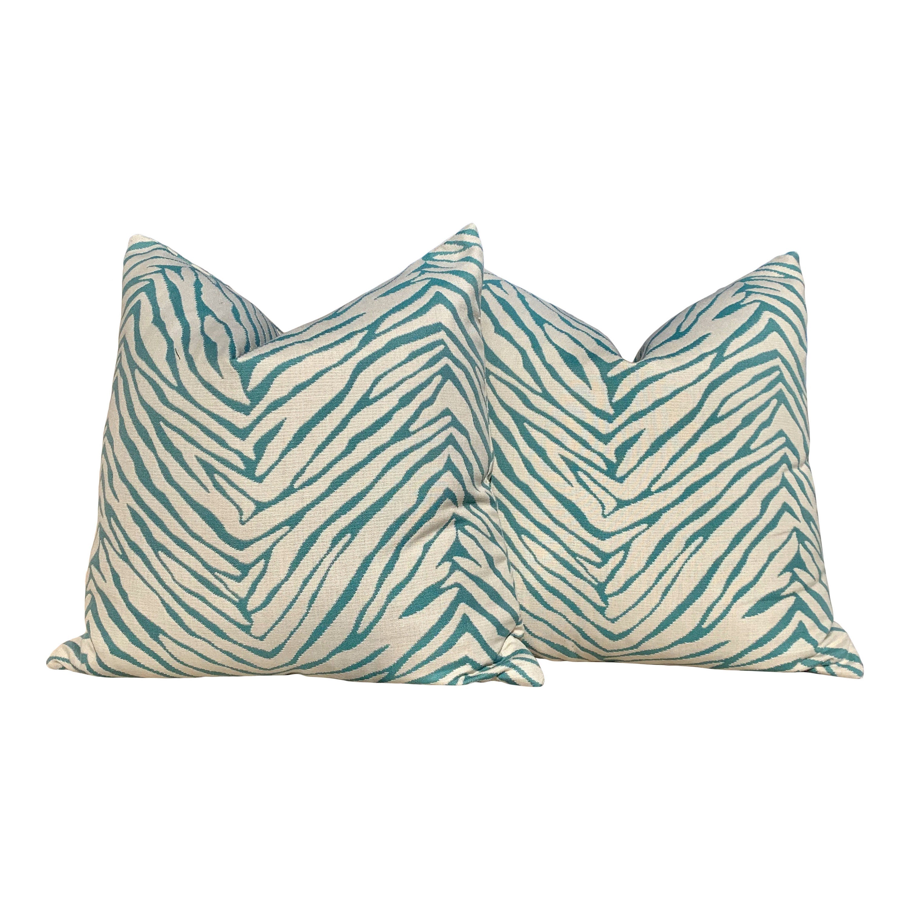 Sunbrella Striped Outdoor Pillowin Aqua. Lumbar Outdoor Pillow in Spa.